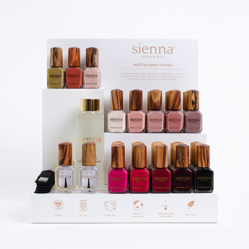 sienna small white display stand with autumn colours on white background
